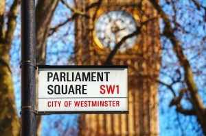 LONDON - APRIL 12: Parliament square sign in city of Westminster on April 12 2015 in London UK. It's a square at the northwest end of the Palace of Westminster in London.