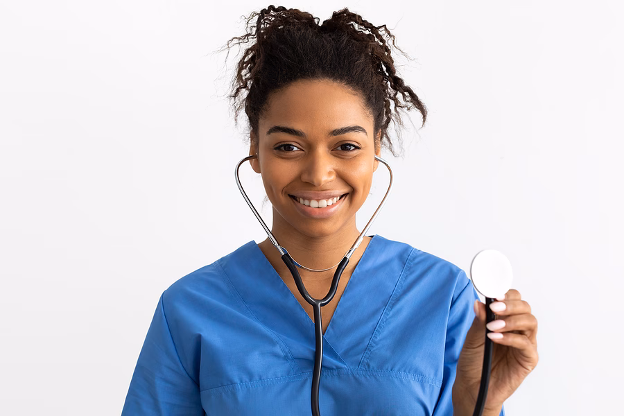 Portrait Of Black Doctor Smiling And Showing Stethoscope Portrait of young doctor smiling and showing stethoscope