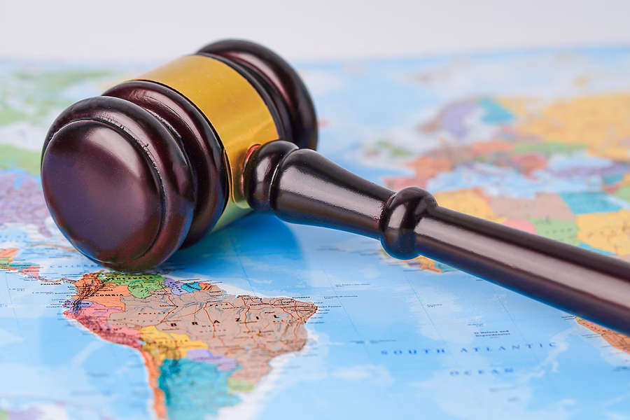 Law gavel on world map, symbolising the International Law and Global Security Summer School.